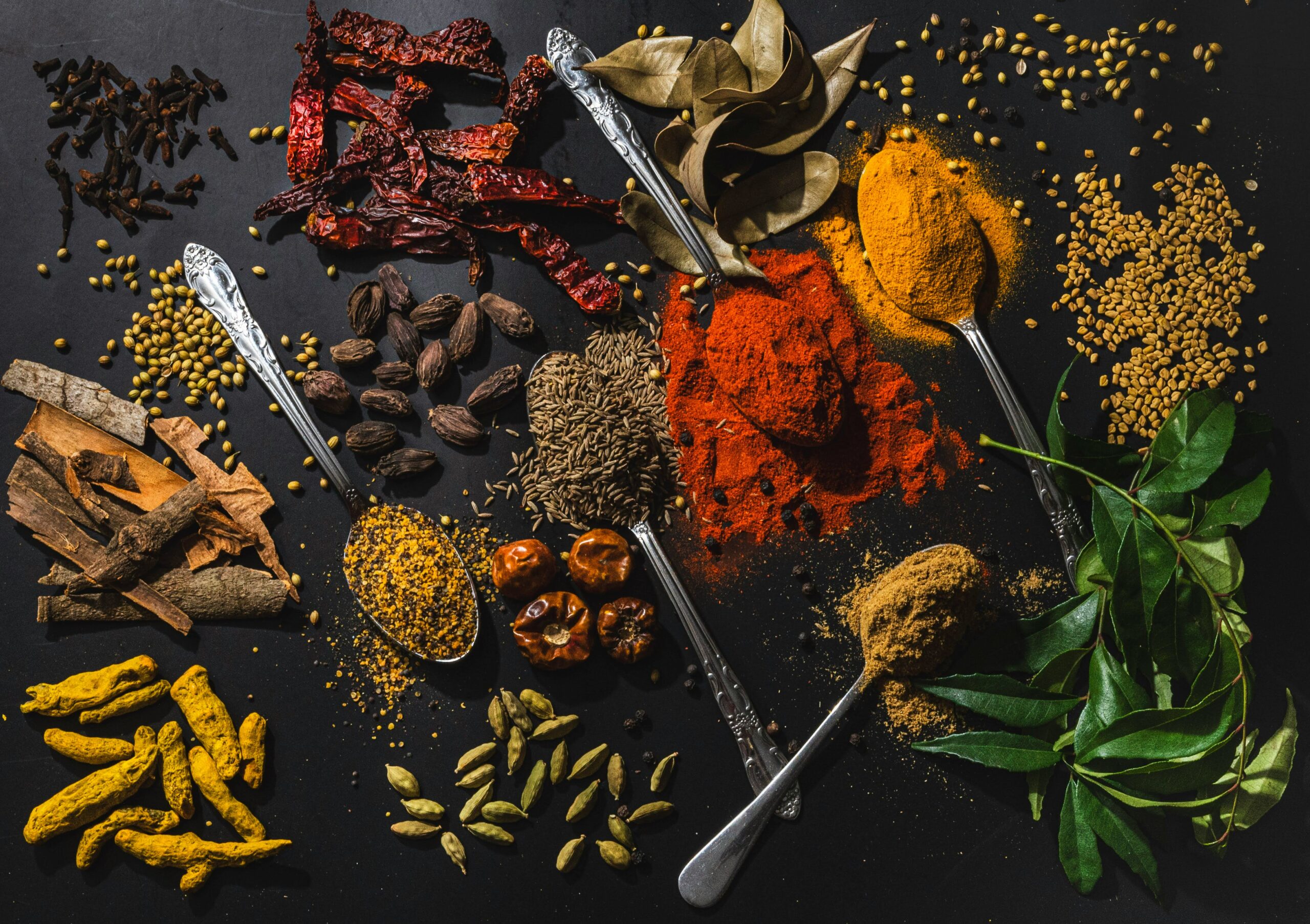 Assorted spices on a wooden table